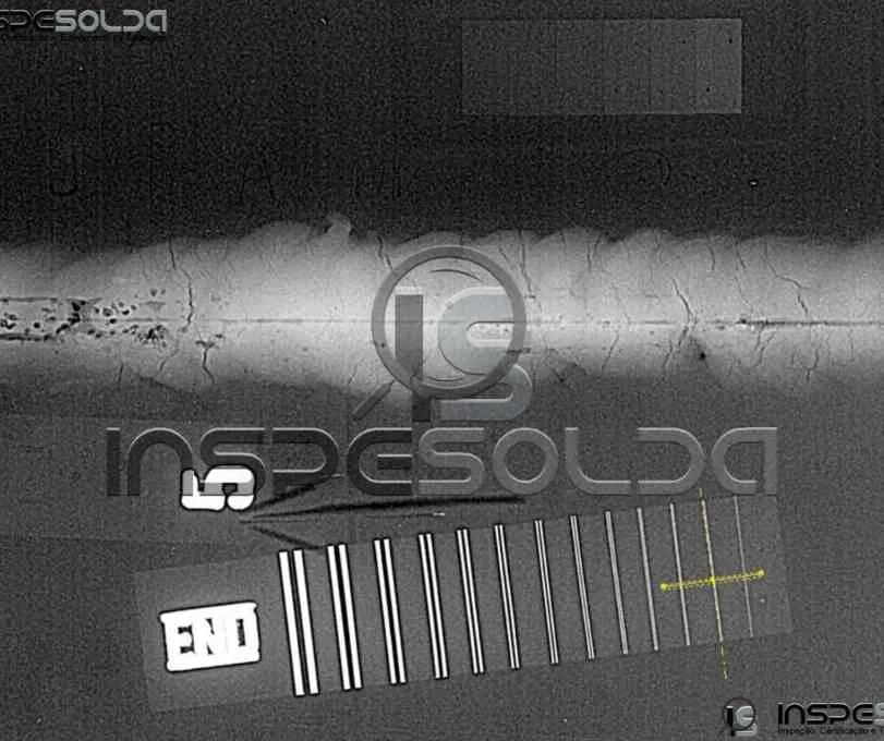 Ensaio de Radiografia Industrial 2 Imagem radiográfica de solda com indicador de qualidade de imagem (IQI).